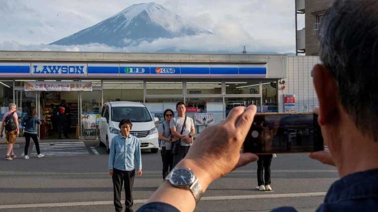 Dunya News Japanese town erects barrier to block Mount Fuji view from tourists