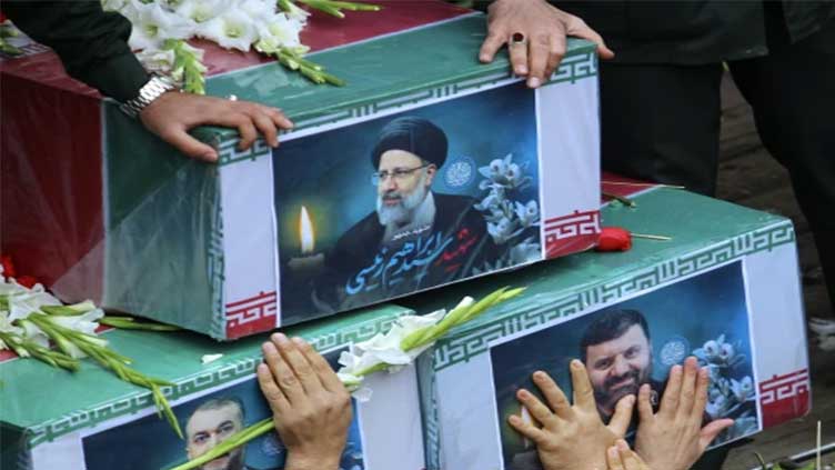 Mourners begin days of funerals for Iran's president and others killed in helicopter crash