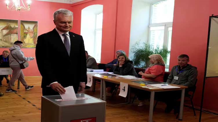 Lithuanians vote in presidential election overshadowed by Russia