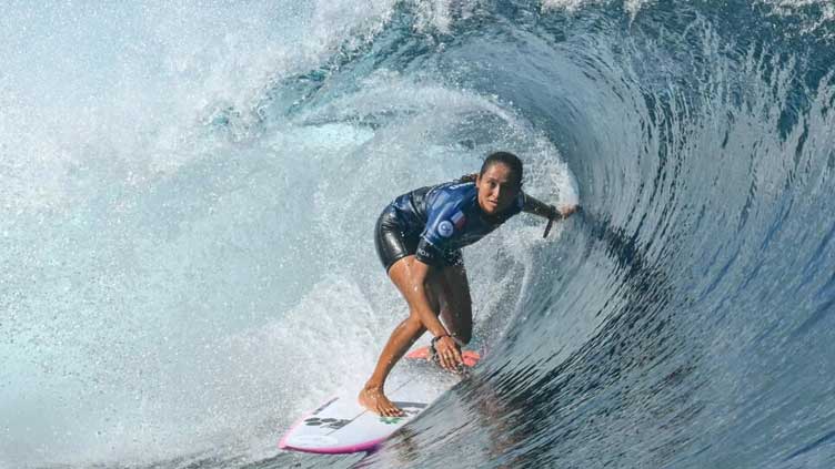 French Olympic surfer Fierro rides the waves to victory in Tahiti