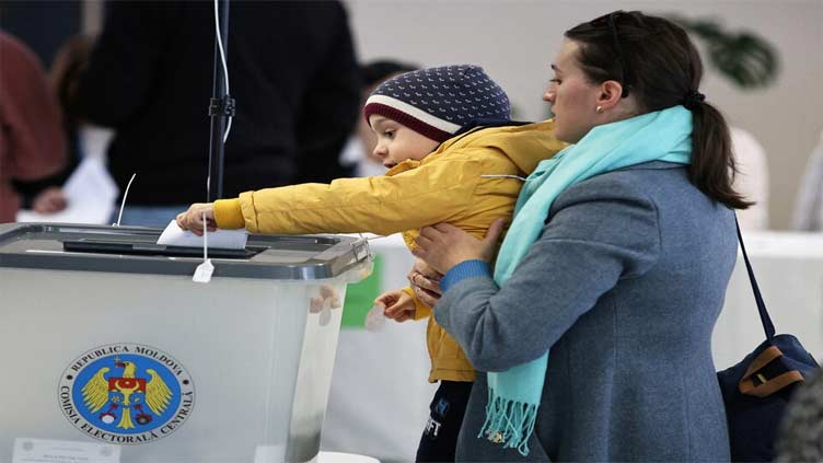 Moldovans vote in presidential runoff amid fears of meddling