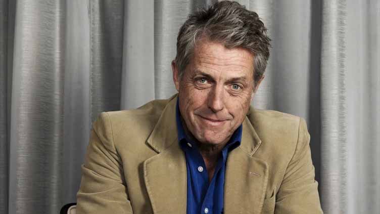 Hugh Grant spent half his career in rom-coms. Now he plays monsters, and he's never been happier