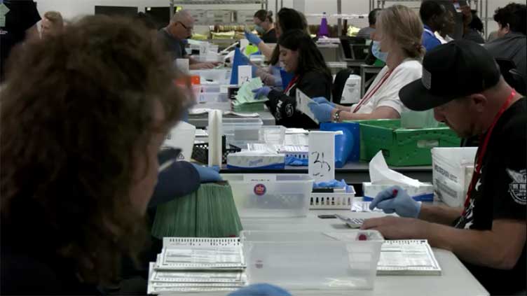 Ballots processed in Phoenix tabulation center in battleground Arizona as polls close