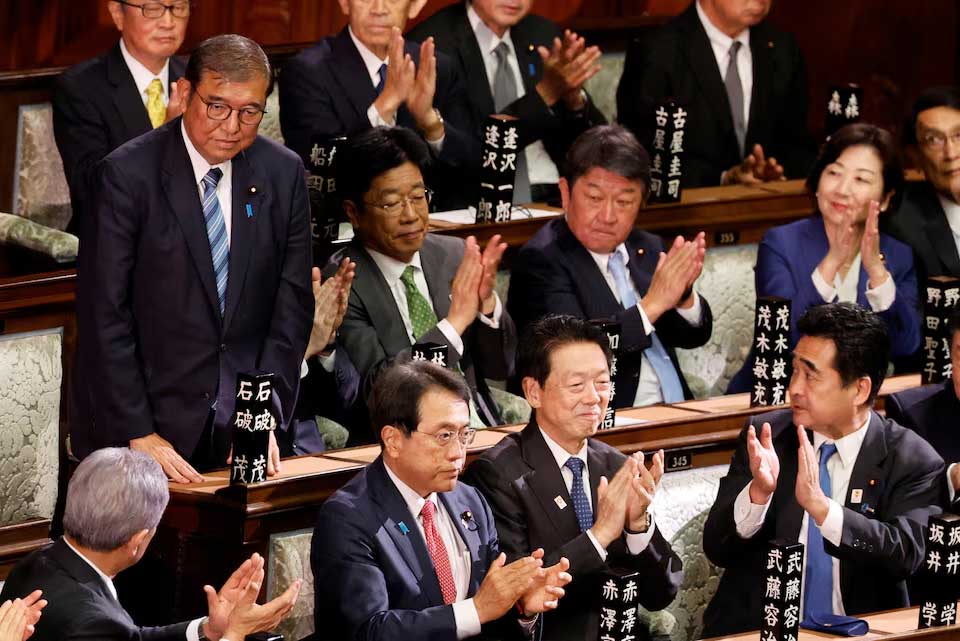 Japan PM Ishiba survives parliament vote as Trump looms large