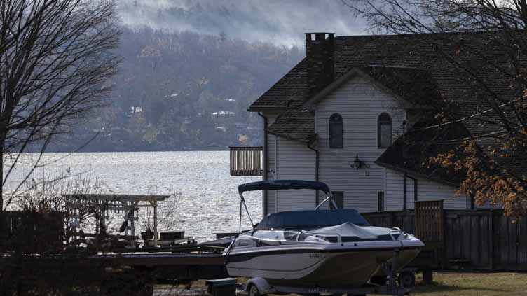 Fire crews on both US coasts battle wildfires