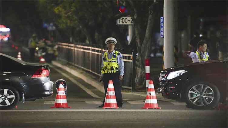 35 dead as a driver hits a crowd at sports center in a southern Chinese city