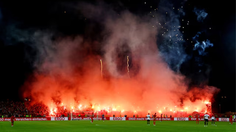 Bayern fined 150,000 euros after fans disrupt Cup game with flares, fireworks