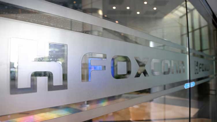 Foxconn sees robust AI server demand, delays EV target