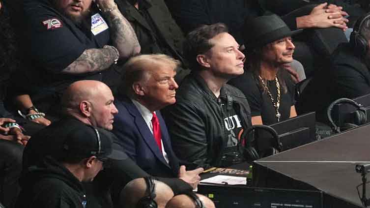 Trump attends UFC championship fight in New York, taking a break from Cabinet picks