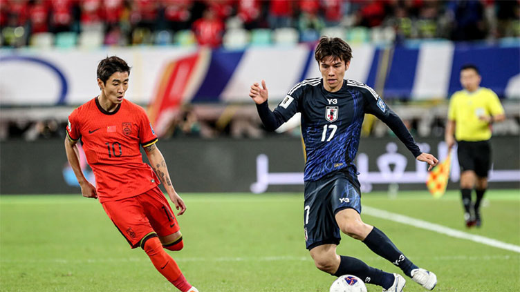 Ruthless Japan beat China to move to brink of World Cup qualification