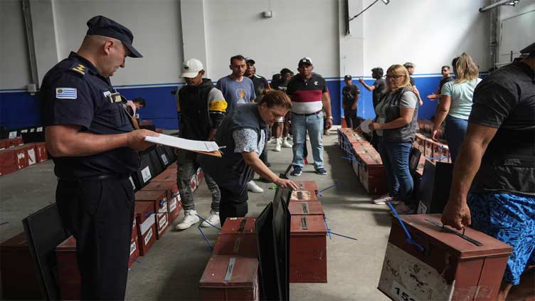 Uruguay votes for next president in closely fought runoff race