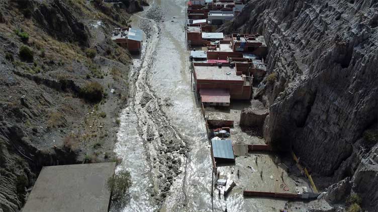 Bolivia's heavy rains cause river to flood homes near La Paz