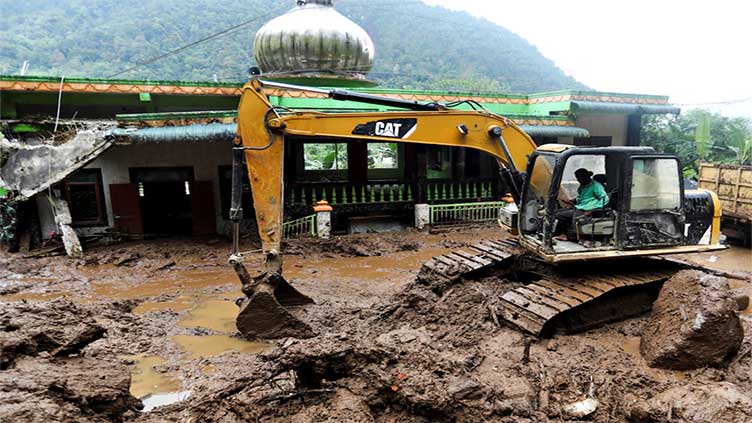 Indonesia province resumes search for 7 missing after landslide and floods kill 15