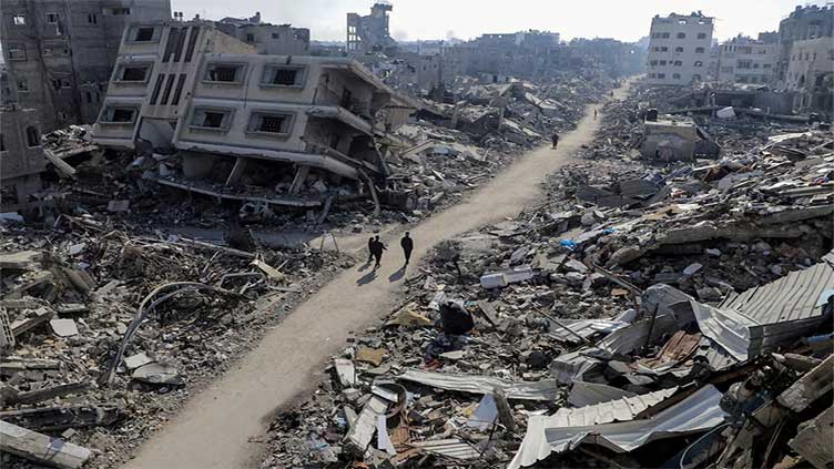 After a year of war, Gazans wonder how to deal with tonnes of rubble