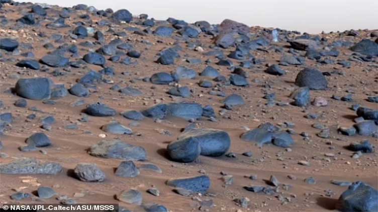 Clearest view of Mars shows blue rocks littering Martian landscape