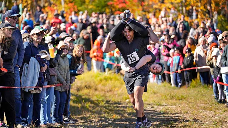 Annual wife-carrying championship attracts many couples in competition