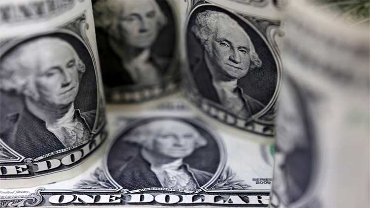 Dollar holds gains while investors parse China's stimulus plans