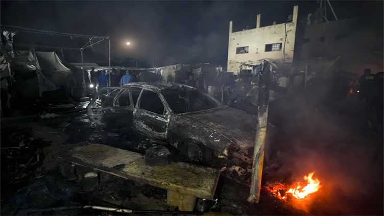 Israeli strike on hospital tent camp kills 4 and ignites a fire that burns dozens