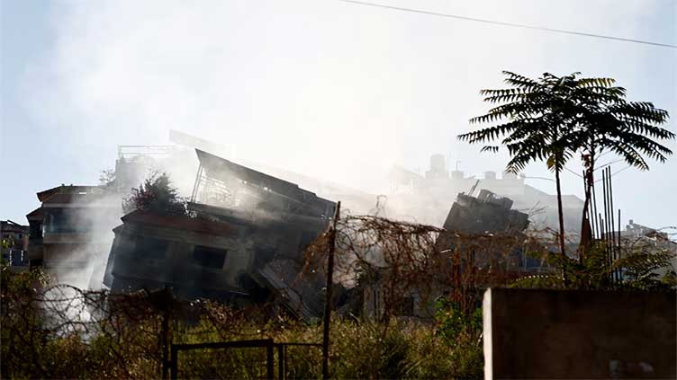 Israel pounds Beirut and Gaza, more than 100 killed, local officials say