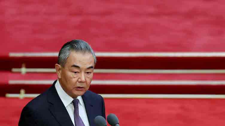 China urges Japan to maintain 'mutually cooperative, non-threatening' ties, says Wang Yi