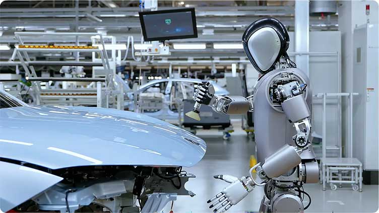 Robots begin taking human jobs at world's biggest electric car maker