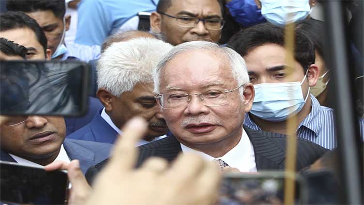 Jailed former Malaysian leader apologizes for fund embezzlement scandal, reiterates his innocence