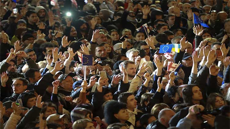 Tens of thousands rally in Georgia to denounce the parliamentary election they say was rigged