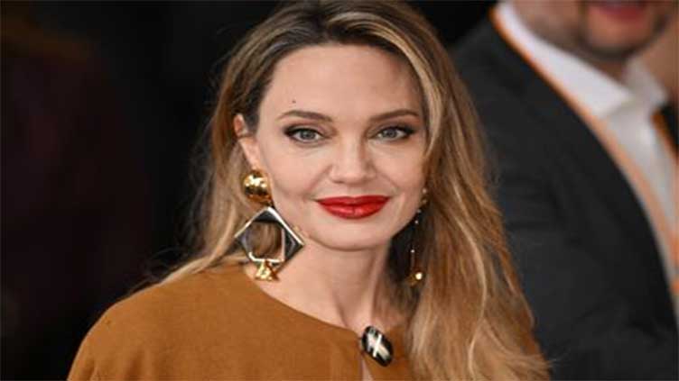 Angelina says an ex was 'not kind' to her about her singing