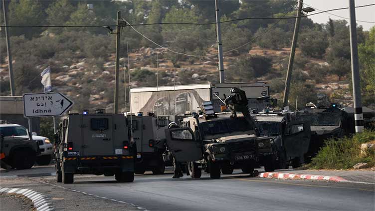 At least two Israelis killed in West Bank shooting attack, medics say