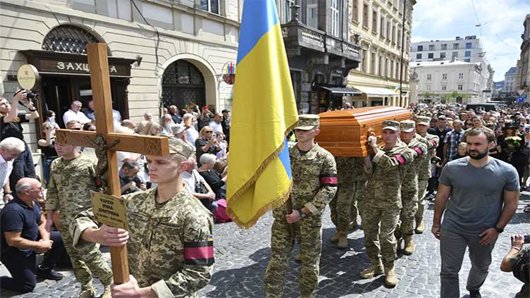 Russia fires a barrage of drones, cruise and ballistic missiles at Kyiv as children return to school