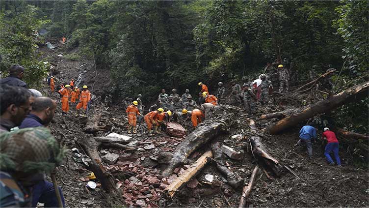 Storm sets off floods and landslides in Philippines, leaving at least 14 dead