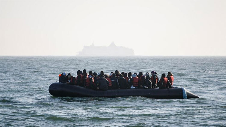 Boat carrying migrants capsizes in English Channel, killing at least 12