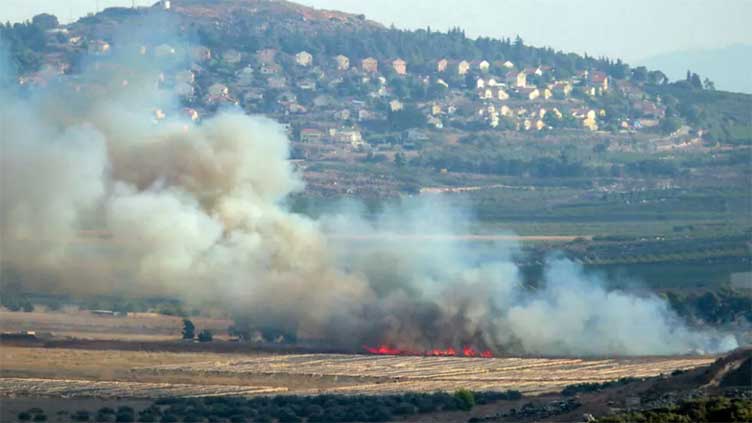 Hezbollah fires rockets, Israel strikes after attack kills Lebanese emergency workers