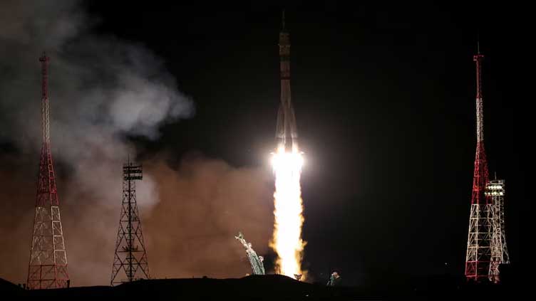 Spacecraft carrying Russians and American takes off from Baikonur cosmodrome