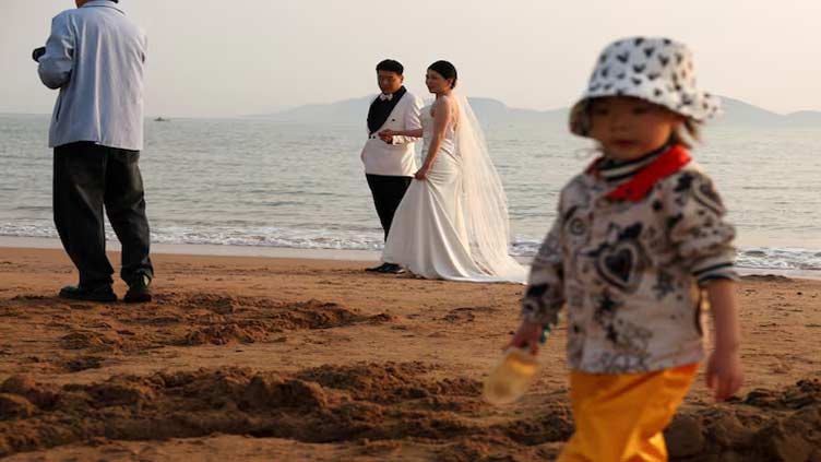 China's top health body urges marriage, childbirth at 'appropriate ages'