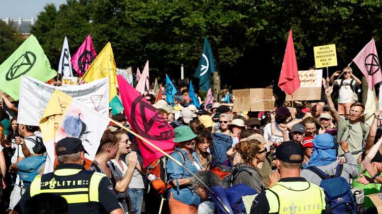 Climate protesters block Dutch highway while police strike