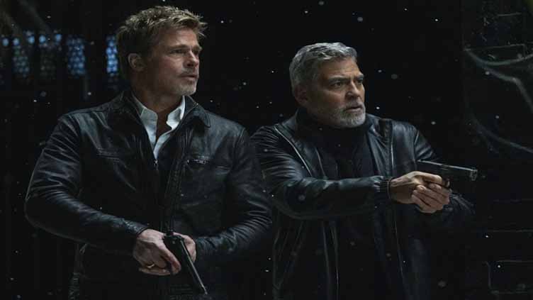 Review: Clooney and Pitt carry the fixer caper 'Wolfs'