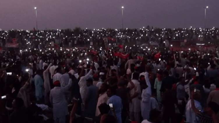 PTI leaders, supporters stay put despite dusk at public gathering venue