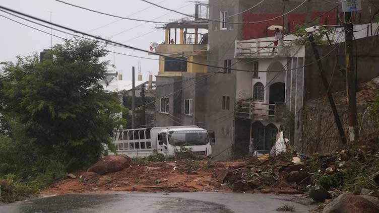 Storm John dumps nearly one meter of rain on southern Mexican state