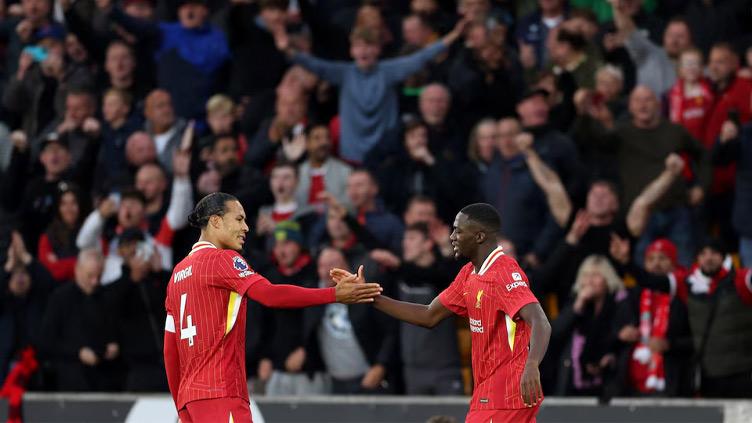 Liverpool go top of Premier League with 2-1 win over hapless Wolves