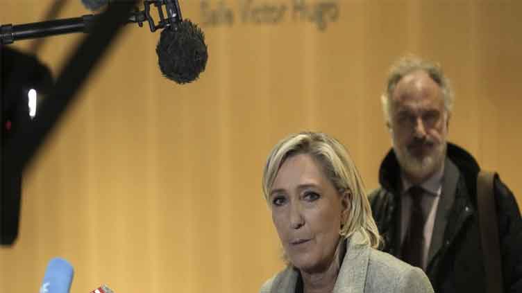 France's Le Pen denies wrongdoing as she and her party go on trial accused of embezzling EU funds