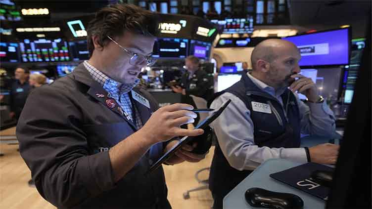 US stocks climb in shaky trading but the US dollar and government bonds sink as trade-war fears rise
