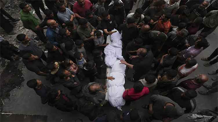 Israeli strike on school-turned-shelter kills 23 as Arab mediators seek long-term Gaza truce
