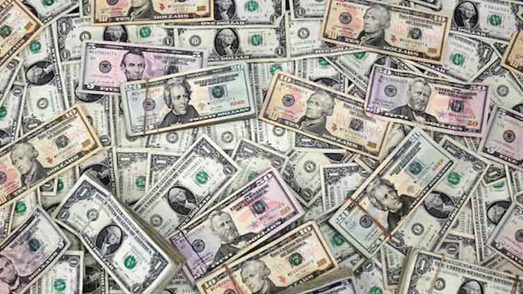 Dollar drifts higher at end of volatile week of Trump backflips
