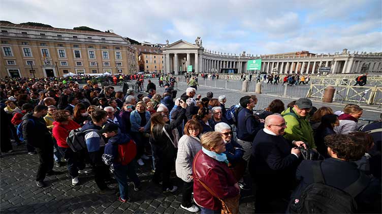 Crowds file into St. Peter's on last day to pay respects to Pope Francis