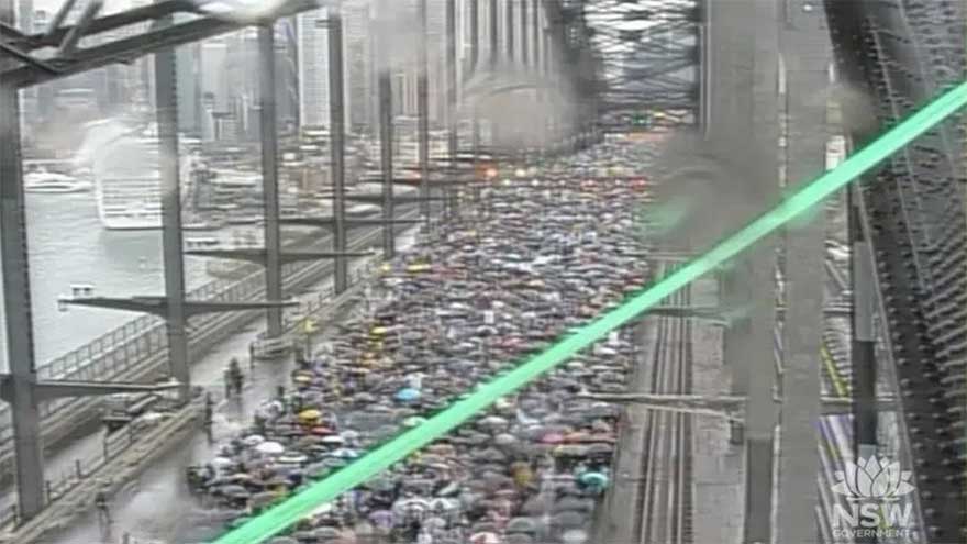 Assange joins pro-Palestinian protest on Sydney Harbour Bridge