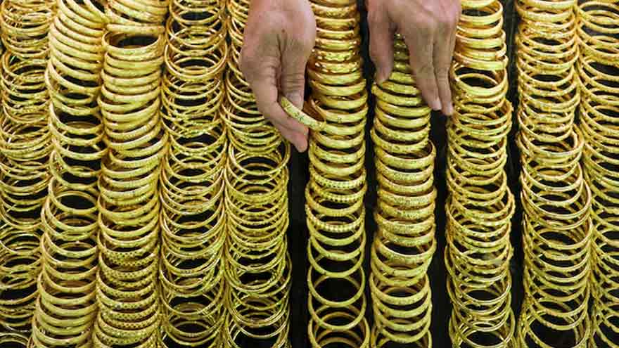 Gold eases on profit taking after rally on US jobs surprise