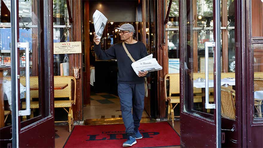 Last newspaper hawker in Paris, a Pakistani migrant, to be knighted by Macron
