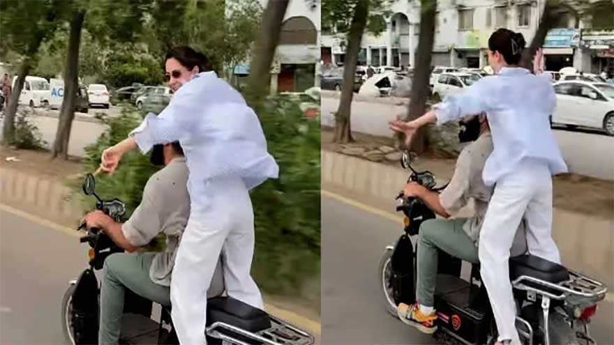 Hania Aamir riding a bike in Karachi