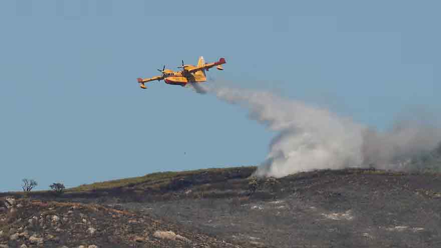 Volunteer firefighter dies in Spain as wildfires rage